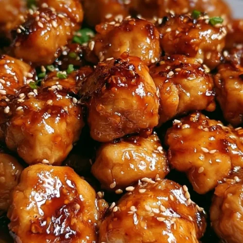 Honey Garlic Chicken Bites 3 Honey garlic chicken bites glazed in a sticky sauce and garnished with green onions