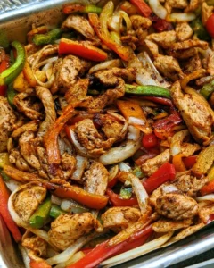 Delicious Sheet Pan Chicken Fajitas with colorful peppers and spices.