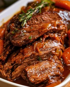 Delicious slow cooker beef brisket served with gravy and sides