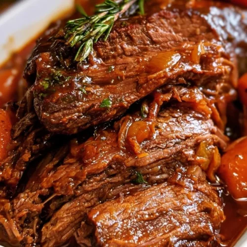 Slow Cooker Brisket with Onions and Brown Sugar Gravy 3 Sliced slow cooker brisket with onions and gravy on a plate